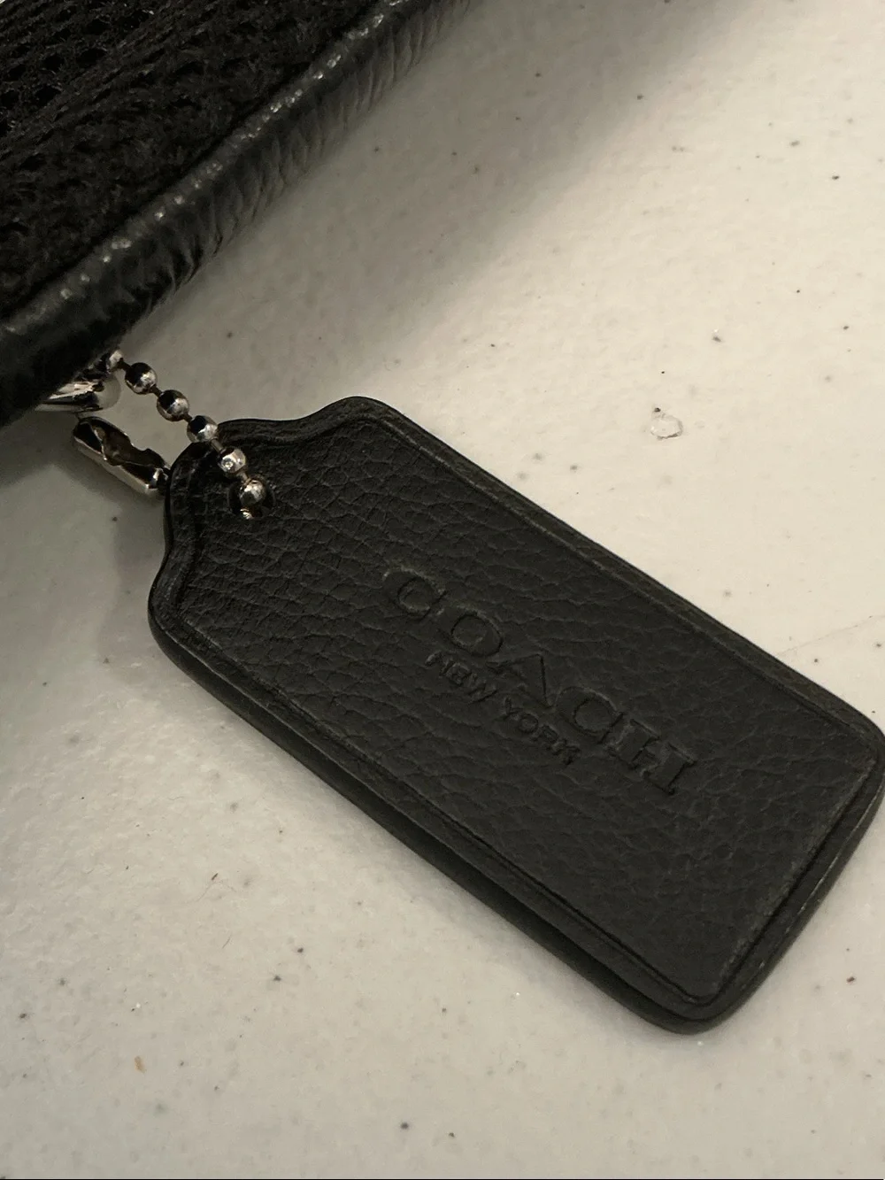 Coach Black Leather Sling Backpack with Front Pocket